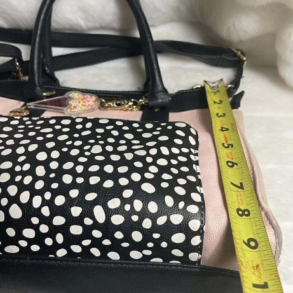 Betsey Johnson vegan leather pink & beige with black & white pocket,black straps